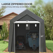 Front view of the zippered door opened wide with a scooter and mower stored inside