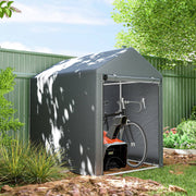 Storage shed tent standing beside a green garden fence with a bicycle parked inside