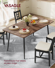 Natural Walnut dining table laid for dessert in a kitchen with black dining chairs
