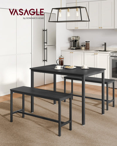 Charcoal grey and black dining table and benches styled in a kitchen with coffee cups on the table