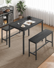 Close-up of the dining table's steel frame and dark tabletop finish