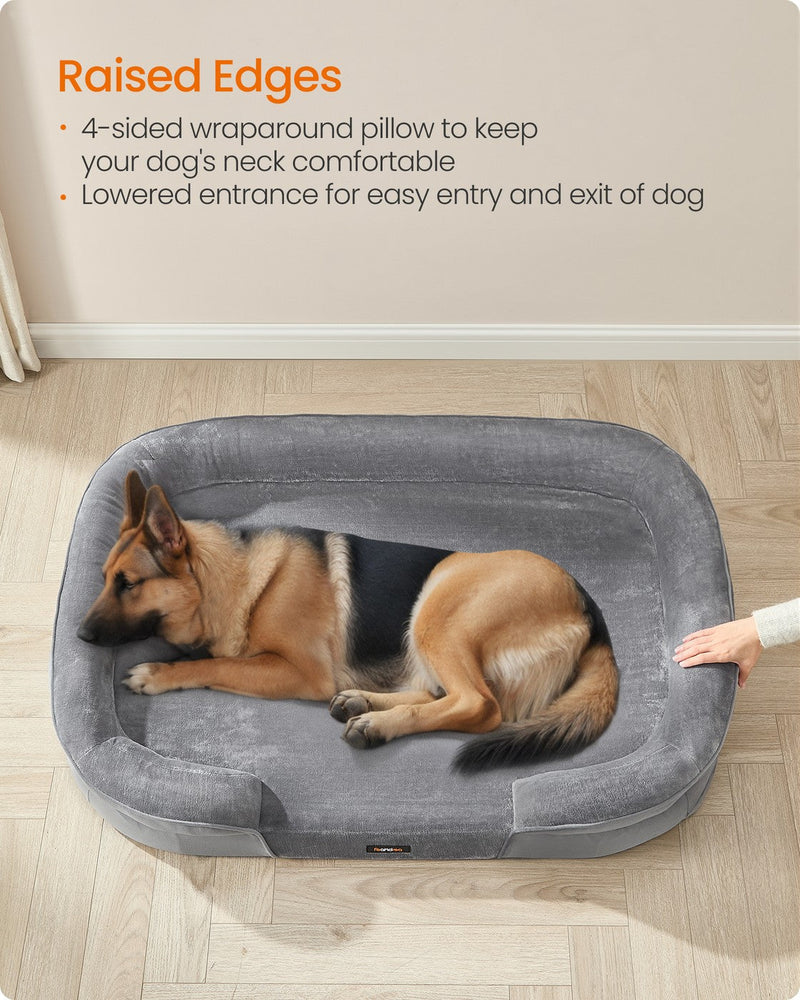 German Shepherd lying against the raised cushioned rim of the dog sofa bed
