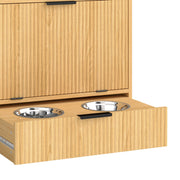 Bowl drawer pulled out showing two stainless steel bowls under the closed cabinet door
