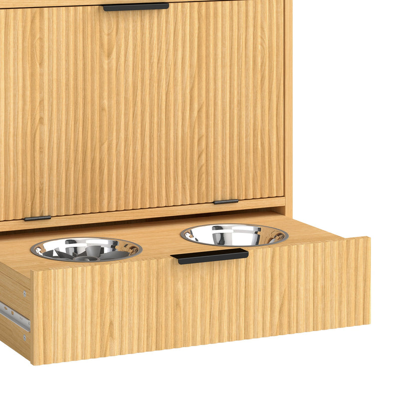 Bowl drawer pulled out showing two stainless steel bowls under the closed cabinet door