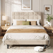 Upholstered double bed dressed with white and olive bedding between two wooden bedside tables
