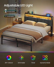Bed frame at night with the LED strip lit warm gold, showing the remote control and on off switch