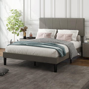 Double bed frame made up with white and pink pillows and a teal throw in a panelled bedroom