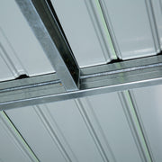Close-up inside the shed of the galvanised steel roof beam and bolted bracket joint