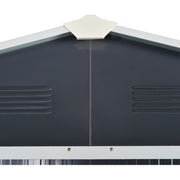 Close-up of the dark grey gable end showing the cream apex cap and two pressed louvre vents