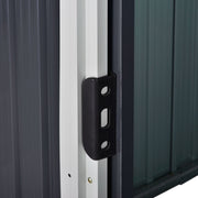 Close-up of the black sliding door handle mounted on the shed's white door frame