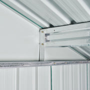 Inside the shed roof showing a galvanised steel purlin bolted to the wall frame under pale roof panels