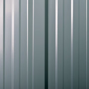 Close-up of the ribbed dark grey steel cladding panel used for the shed walls