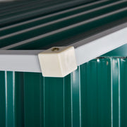 Close-up of the cream plastic corner cap where the green roof panel meets the white wall trim