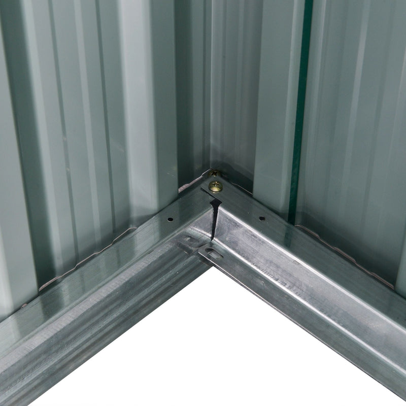 Inside corner of the shed showing the galvanised steel base rail bolted to the pale interior wall panels