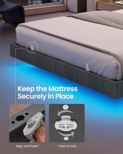 Close-up of a mattress retainer on the upholstered grey side rail above the blue underglow