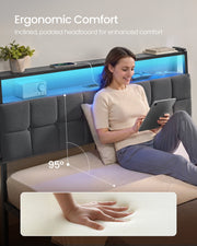 Woman reading against the 95 degree padded headboard with the lit shelf behind her