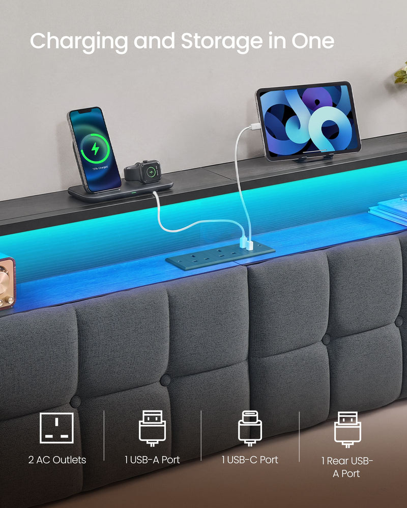 Close-up of the headboard shelf and built-in socket strip charging a phone and tablet