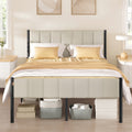 Cappuccino beige double bed frame with a fluted upholstered headboard and footboard on black metal posts, storage boxes tucked underneath