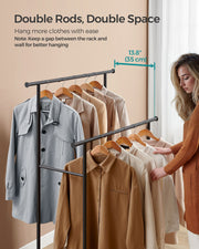 Woman browsing clothes on the double rods showing the 35 cm gap between rods and wall