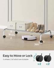 Double rod clothes rail styled with garments hanging in a bedroom