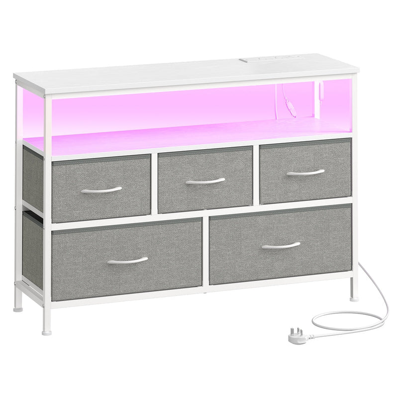 Angled view of the dresser showing the lit open shelf and mains power lead