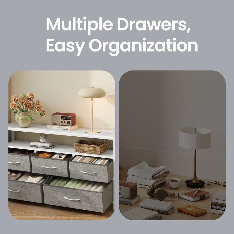 Open drawers showing folded clothes, books and magazines stored in the dresser