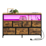Dresser styled with a photo frame and plant, open shelf lit pink