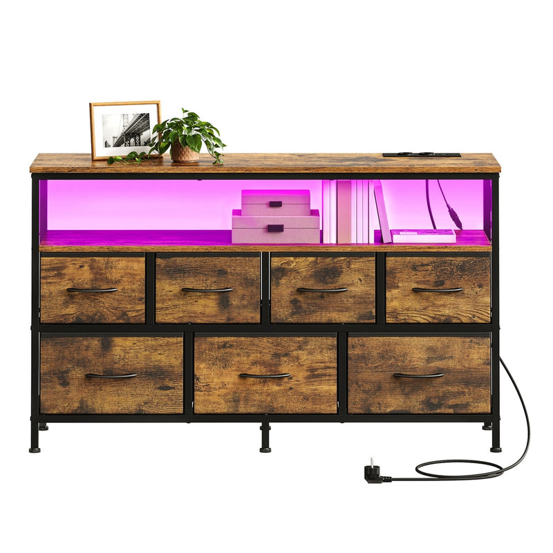 Dresser styled with a photo frame and plant, open shelf lit pink