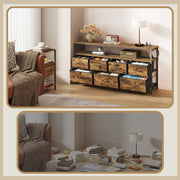 Dresser used as a console beside an armchair with a throw, lamp and books on the open shelf