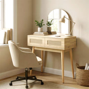 Dressing table styled as a home office desk with a chair and lamp