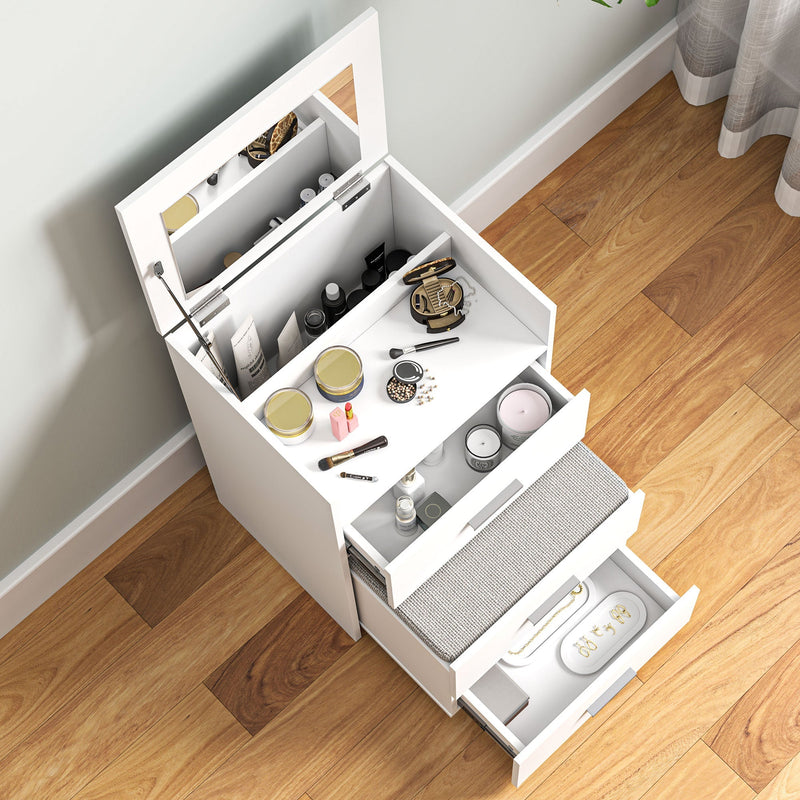 Close-up of the open mirror, tabletop compartment and drawers filled with make-up