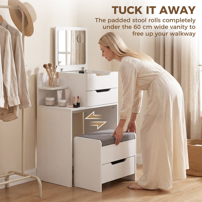 Woman sliding the padded stool under the 60 cm wide vanity