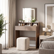 Dressing table styled in a bedroom with a stool, floor lamp and bedside table