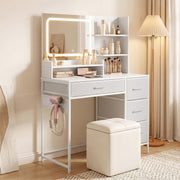 White dressing table with lit LED mirror styled with cosmetics on the tabletop