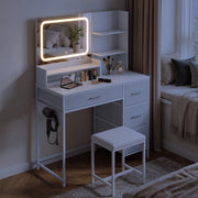 White dressing table with LED mirror lit in a bedroom at night