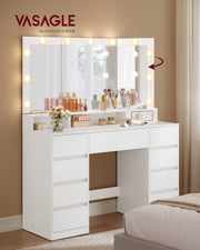 White dressing table in a bedroom with the lit tri-fold mirror and perfume and make-up on the top shelf