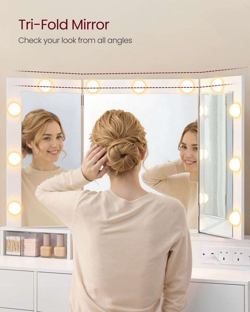 Woman checking her hair in the tri-fold mirror with both side panels angled in