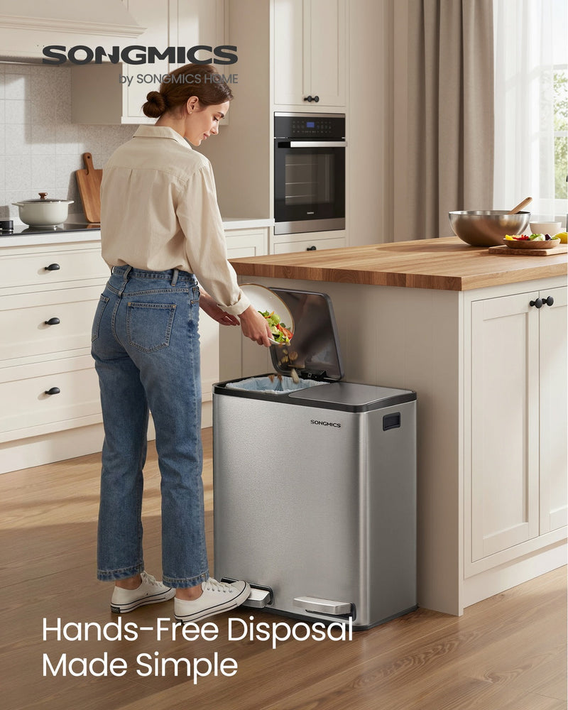 Woman disposing of food waste into the dual compartment kitchen bin in a kitchen