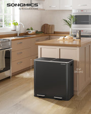 Black dual pedal bin styled in a modern kitchen