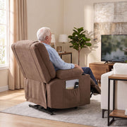 Rear view of a man reclining in the brown chair while watching television