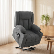 Dark grey electric lift recliner chair angled in a living room setting