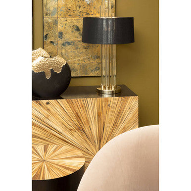 Ebony bamboo console table styled behind a sofa in a living room setting