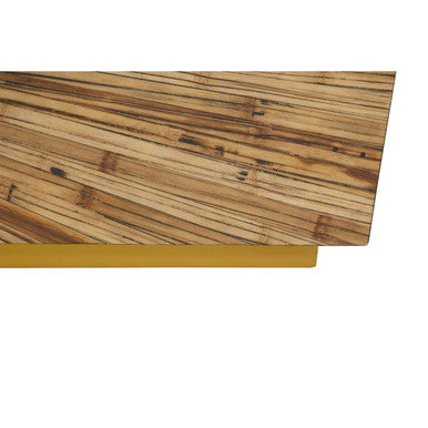 Close-up detail of the join between the gold steel frame and the bamboo tabletop