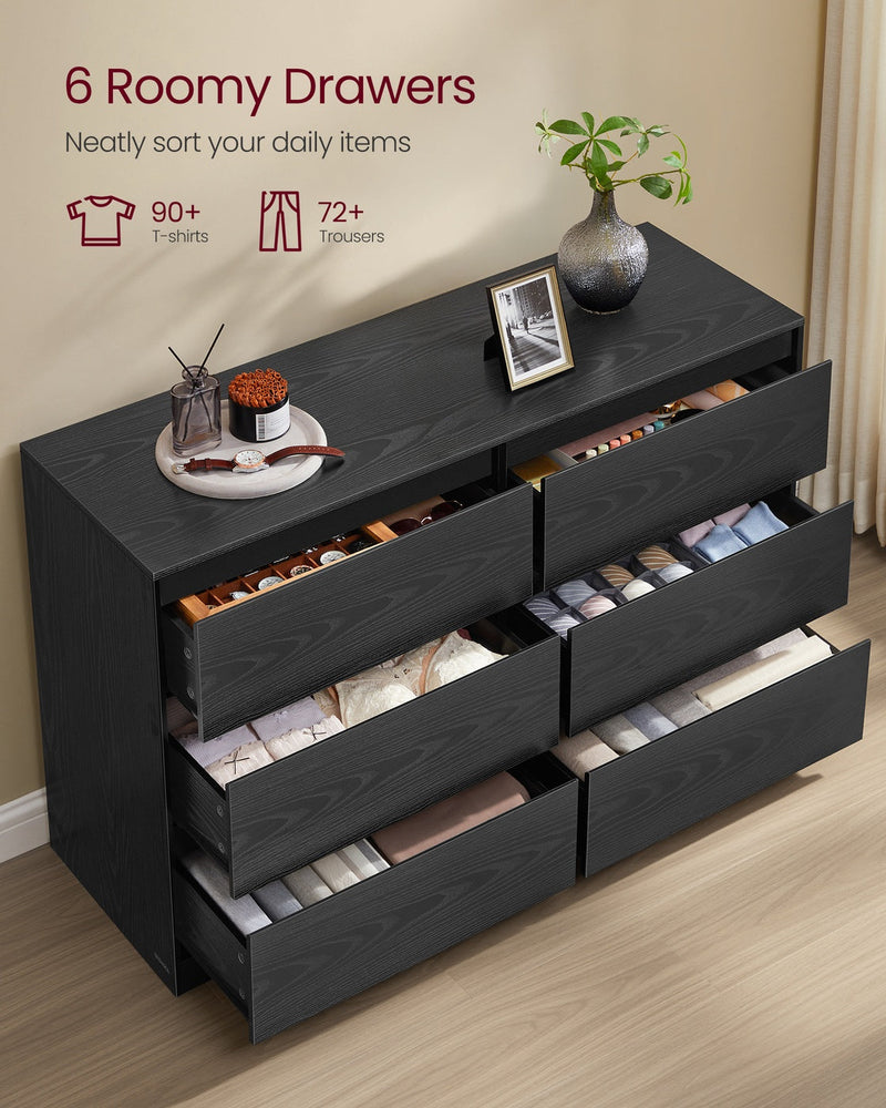 Ebony Black dresser with all 6 drawers pulled open and filled with folded clothes