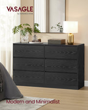 Close view of the Ebony Black wood grain dresser fronts with a mirror and brass lamp above
