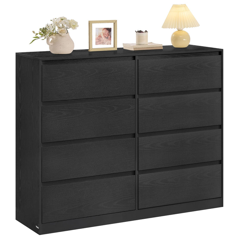 Ebony black 8 drawer chest of drawers with lamp, frame and vase on top