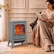 Woman reading under a blanket in an armchair beside the electric stove heater
