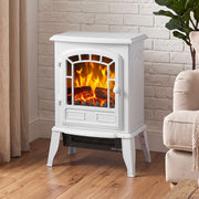 White electric fireplace stove glowing against a white brick wall in a modern living room