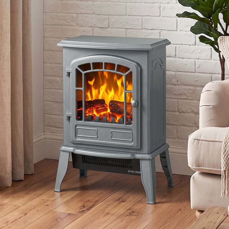 Grey electric fireplace stove beside a curtained window and armchair