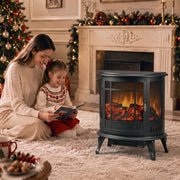 Black electric fireplace stove styled in a living room at Christmas